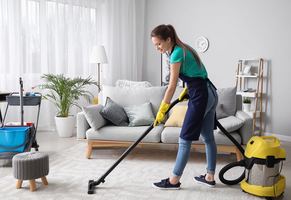 Professional cleaner vacuuming