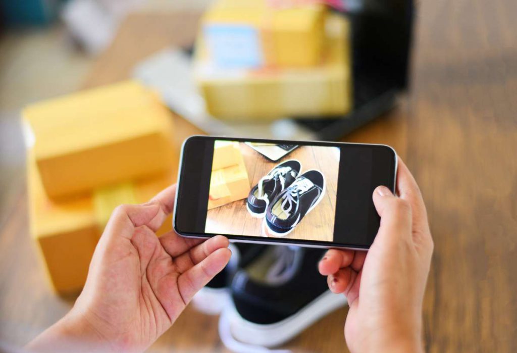 Person capturing favorite pair of sneakers with a mobile phone